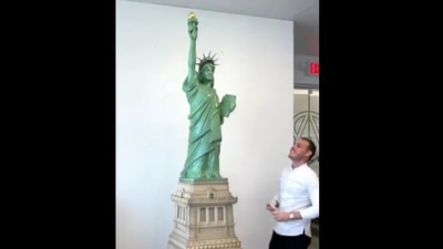 The image shows Amaury Guichon standing beside the seven-foot-long chocolate Statue of Liberty. (Instagram/@amauryguichon) The image shows Amaury Guichon standing beside the seven-foot-long chocolate Statue of Liberty. (Instagram/@amauryguichon)