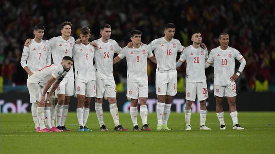 Spain players react during the penalty shootout against Italy at Wembley stadium in London on Tuesday. (AP)