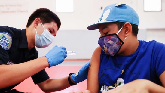 A student getting the Covid-19 vaccine in California on Tuesday.(AFP Photo) A student getting the Covid-19 vaccine in California on Tuesday.(AFP Photo)