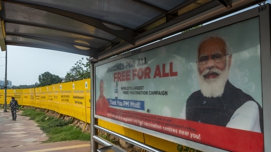 A sign thanking Prime Minister Narendra Modi for providing free vaccines displayed at a bus stop in New Delhi, India, on Sunday, June 28, 2021.(Bloomberg) A sign thanking Prime Minister Narendra Modi for providing free vaccines displayed at a bus stop in New Delhi, India, on Sunday, June 28, 2021.(Bloomberg)