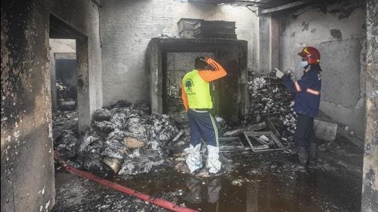 Fire brigade personnel at a company at Urawade area of in Pirangut in Pune. (Pratham Gokhale/HT Photo)