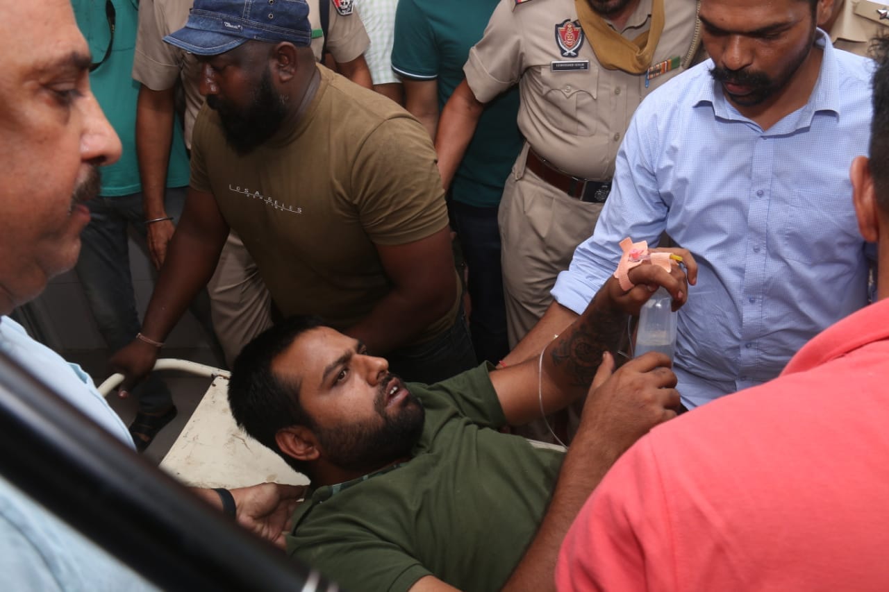 Naruana’s former gunman and key suspect Manpreet Singh Manna being brought to the civil hospital in Bathinda after he suffered a bullet injury. (Sanjeev Kumar/HT) Naruana’s former gunman and key suspect Manpreet Singh Manna being brought to the civil hospital in Bathinda after he suffered a bullet injury. (Sanjeev Kumar/HT)
