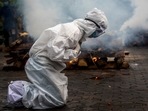 A woman breaks down as she prays before the cremation of a relative who died of Covid-19 in Gauhati, India on July 2. The global death toll from Covid-19 eclipsed 4 million July 7 as the crisis increasingly becomes a race between the vaccine and the highly contagious delta variant, AP reported.(Anupam Nath / AP) A woman breaks down as she prays before the cremation of a relative who died of Covid-19 in Gauhati, India on July 2. The global death toll from Covid-19 eclipsed 4 million July 7 as the crisis increasingly becomes a race between the vaccine and the highly contagious delta variant, AP reported.(Anupam Nath / AP)