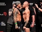 FILE PHOTO: Dustin Poirier and Conor McGregor.