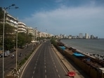 A deserted Marine Drive on a weekday afternoon. Those who haven’t stepped out in a while are in for a rude shock as views of the coastal road construction jut into the Arabian Sea.(Pratik Chorge / HT Photo)