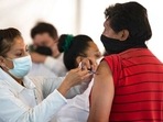 A nurse administers a jab of the AstraZeneca Covid-19 vaccine during a vaccination drive.(AP) A nurse administers a jab of the AstraZeneca Covid-19 vaccine during a vaccination drive.(AP)