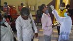 A BMC health worker collects swab samples for Covid-19 test of passengers arriving from outstation trains at Dadar station. (HT file) A BMC health worker collects swab samples for Covid-19 test of passengers arriving from outstation trains at Dadar station. (HT file)