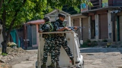 Paramilitary soldiers stand guard on an armored vehicle as they move towards the site of a gunfight in Pulwama, south of Srinagar, in Kashmir, last week. (AP Photo/ Dar Yasin)