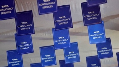 Logos of Tata Consultancy Services (TCS) are displayed at the venue of the annual general meeting of the software services provider in Mumbai. (Reuters)
