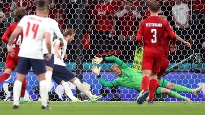 England's Harry Kane scores their second goal from the rebound after Denmark's Kasper Schmeichel saved his penalty (Pool via REUTERS)