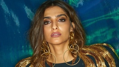 Another outft that Sonam wore was a Schiaparelli number in black with golden sequinned embellishments on the dramatic shoulders. (Instagram) Another outft that Sonam wore was a Schiaparelli number in black with golden sequinned embellishments on the dramatic shoulders. (Instagram)