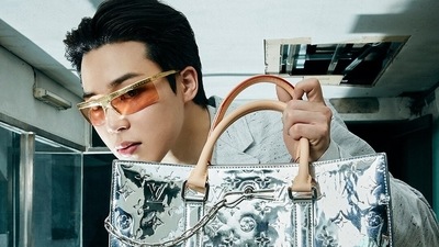 BTS member Jimin wore gold and amber shades and posed with a silver tote bag from the collection. (Instagram)