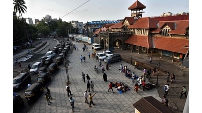 A few stragglers wait for a bus or rickshaw at the Bandra railway station. Commuting has become both easier and more difficult, as crowds thin but trains remain off limits to most and buses continue to restrict the number of passengers. (Satish Bate / HT Photo)