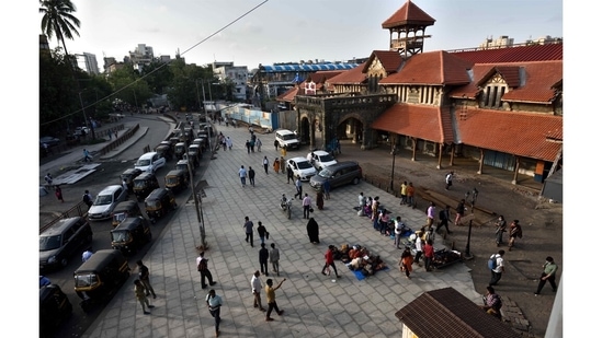 A few stragglers wait for a bus or rickshaw at the Bandra railway station. Commuting has become both easier and more difficult, as crowds thin but trains remain off limits to most and buses continue to restrict the number of passengers.(Satish Bate / HT Photo)