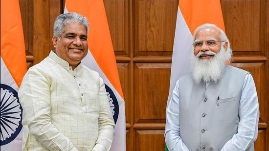 Bhupender Yadav with Prime Minister Narendra Modi before taking oath on Wednesday, July 7. (PTI)