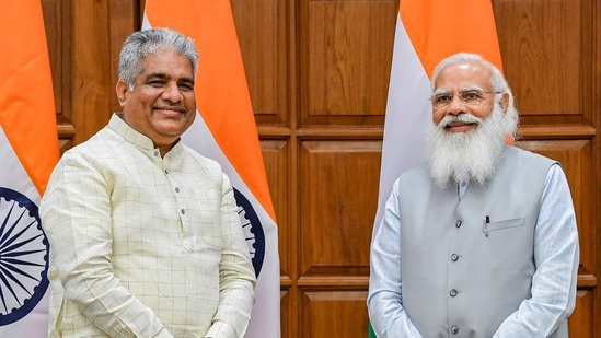 Bhupender Yadav with Prime Minister Narendra Modi before taking oath on Wednesday, July 7. (PTI) Bhupender Yadav with Prime Minister Narendra Modi before taking oath on Wednesday, July 7. (PTI)