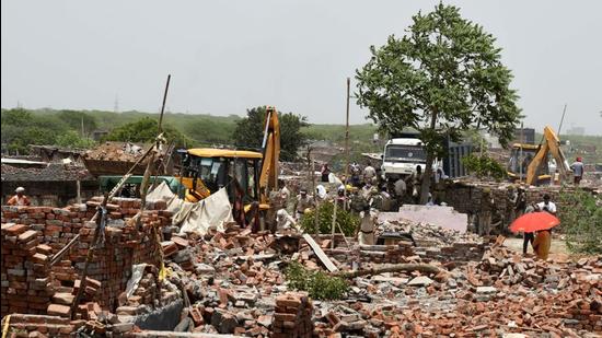 Officials said that more than 100 houses that were partly demolished in a drive on June 16 were completely razed and the ground levelled. (Parveen Kumar/HT Photo) Officials said that more than 100 houses that were partly demolished in a drive on June 16 were completely razed and the ground levelled. (Parveen Kumar/HT Photo)