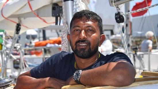 Abhilash Tomy poses on his boat Thuriya ahead of the solo around-the-world sailing race for the Golden Globe Race in 2018. (File photo)