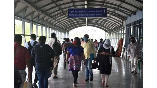 On a Mumbai Metro skywalk, the thinned crowds are in stark contrast with normal rush hour, when the throngs would be a busy blur.(Satish Bate / HT Photo)