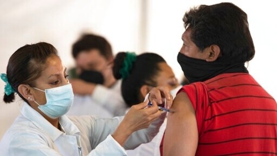 A nurse administers a jab of the AstraZeneca Covid-19 vaccine during a vaccination drive.(AP)