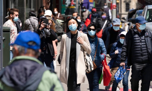 People walk the streets of New York, in the United States, as concerns peak over the spread of the delta variant of the coronavirus disease (Covid-19) in the country. (File Photo)