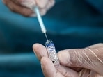 A medical worker prepares a dose of Russia's Sputnik V Covid-19 vaccine.(AFP | Representational image) A medical worker prepares a dose of Russia's Sputnik V Covid-19 vaccine.(AFP | Representational image)