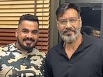 Ajay Devgn poses with his bodyguard Gautam. Ajay Devgn poses with his bodyguard Gautam.