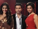 Sonam Kapoor and Deepika Padukone pose with Karan Johar on Koffee with Karan. Sonam Kapoor and Deepika Padukone pose with Karan Johar on Koffee with Karan.