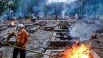 A worker stoking a funeral pyre during cremations of Covid-19 victims at Sarai Kale Khan crematorium, in New Delhi, India, on Thursday, May 06, 2021. (Photo by Amal KS / Hindustan Times) A worker stoking a funeral pyre during cremations of Covid-19 victims at Sarai Kale Khan crematorium, in New Delhi, India, on Thursday, May 06, 2021. (Photo by Amal KS / Hindustan Times)