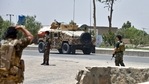 Afghan security personnel stand guard along the road amid ongoing fight between Afghan security forces and Taliban fighters in Kandahar on July 9, 2021. (AFP) Afghan security personnel stand guard along the road amid ongoing fight between Afghan security forces and Taliban fighters in Kandahar on July 9, 2021. (AFP)