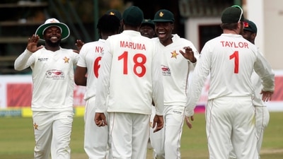 Zimbabwean cricket players celebrate the wicket of Bangladesh batsman Shakib Al Hasan. (AP)