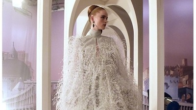 One voluminous dress in soft grey was adorned in floating feathers, while other evening looks included sparkly sequined creations.  (Instagram)