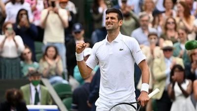 Serbia's Novak Djokovic celebrates winning his quarter-final match against Hungary's Marton Fucsovics. (REUTERS)