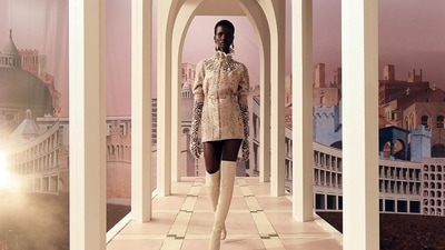 Models also wore strapless see-through gowns with embroidered florals, ruffled frocks, short lace dresses, printed coats and trouser suits adorned with acorn depictions. (Instagram)