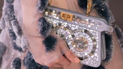A model carries a bag by Fendi on the runway. (Instagram)