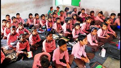 Students sitting on the floor and studying in a UP government upper primary school. (HT file photo) Students sitting on the floor and studying in a UP government upper primary school. (HT file photo)
