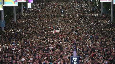 Fans celebrate outside the Wembley Stadium after England qualified for the Euro 2020 final on Wednesday. (AP) Fans celebrate outside the Wembley Stadium after England qualified for the Euro 2020 final on Wednesday. (AP)