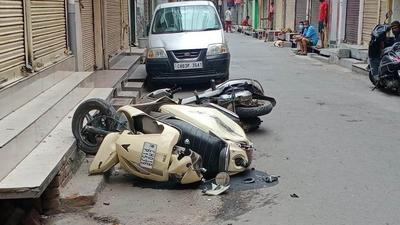 A scooter damaged by the pickup truck in Manimajra. (HT PHOTO)