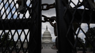 The US Capitol is seen behind fences on July 9, 2021 in Washington, DC. (AFP) The US Capitol is seen behind fences on July 9, 2021 in Washington, DC. (AFP)