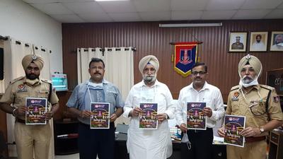 Punjab jails minister with the first copy of a magazine that inmates at the Patiala Central Jail have produced. (HT Photo) Punjab jails minister with the first copy of a magazine that inmates at the Patiala Central Jail have produced. (HT Photo)