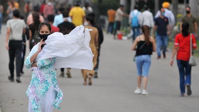 A woman’s dupatta wafts in the wind at Sukhna Lake in Chandigarh. (Ravi Kumar/HT)