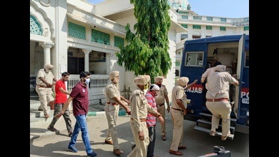 The accused Dera Sacha Sauda followers being taken out of a Faridkot court in May. (HT Photo) The accused Dera Sacha Sauda followers being taken out of a Faridkot court in May. (HT Photo)