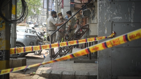 Delhi Police investigating the spot where two people were shot dead in a firing incident at Bada Hindu Rao in New Delhi, India, on Friday, July 9, 2021. (Photo by Sanchit Khanna/ Hindustan Times)