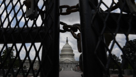 The US Capitol is seen behind fences on July 9, 2021 in Washington, DC.(AFP)