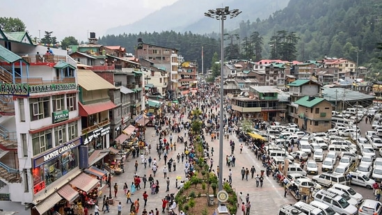 Tourists visit the Mall Road afoter relaxation in Covid-19 curfew, in Manali, Saturday, July 3, 2021. (PTI)