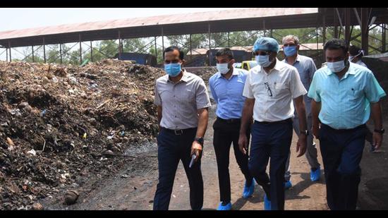 UT adviser Dharam Pal (second from right) with MC officials during his visit to the Dadumajra waste processing plant in Chandigarh on Friday. (Keshav Singh/HT)