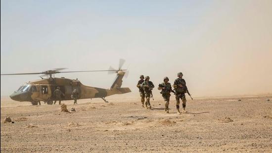 Afghan National Army 215th Corps troops disembark an Afghan Air Force (AAF) Black Hawk helicopter during a troop re-supply at Camp Shorabak in Helmand Province in 2018. (Representational image/REUTERS)