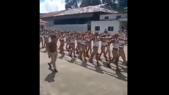 The screengrab from the video shared by Anand Mahindra shows the contingent marching to a Bollywood song.(Twitter/@anandmahindra)
