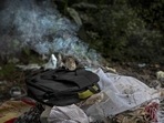 Clothes of a deceased Covid-19 victim lie in a cremation ground in Guwahati on July 2. India’s devastating Covid-19 surge in April and May left crematoriums overwhelmed with pyres often lit around the clock.(Anupam Nath / AP) Clothes of a deceased Covid-19 victim lie in a cremation ground in Guwahati on July 2. India’s devastating Covid-19 surge in April and May left crematoriums overwhelmed with pyres often lit around the clock.(Anupam Nath / AP)