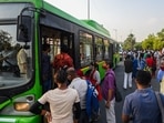 Commuters attempt to board a low-floor DTC bus at Krishi Bhawan, in New Delhi, India, on Monday, April 12, 2021. (Photo by Amal KS/ Hindustan Times)